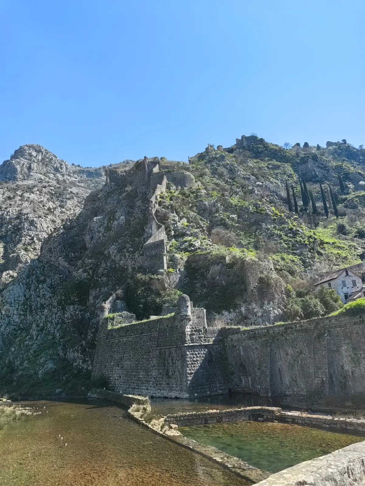 Ancient walls of Kotor Fortress climbing the mountainside